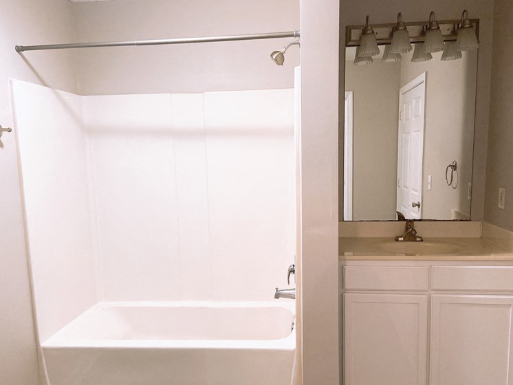 bathroom with large tub and sink in Fayetteville NC apartment